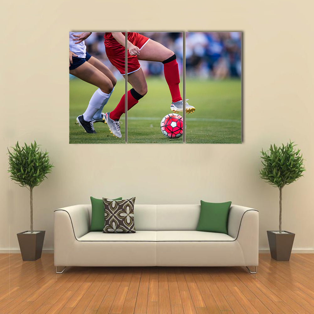 Women playing in a soccer game on a soccer field Multi panel canvas wall art