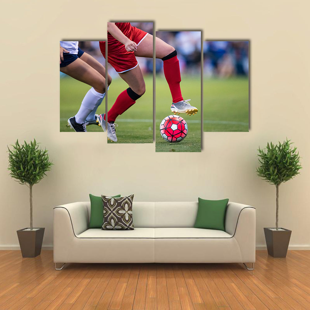 Women playing in a soccer game on a soccer field Multi panel canvas wall art