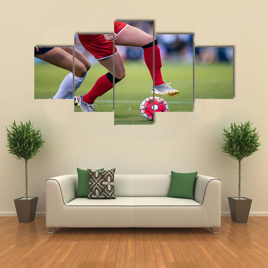Women playing in a soccer game on a soccer field Multi panel canvas wall art