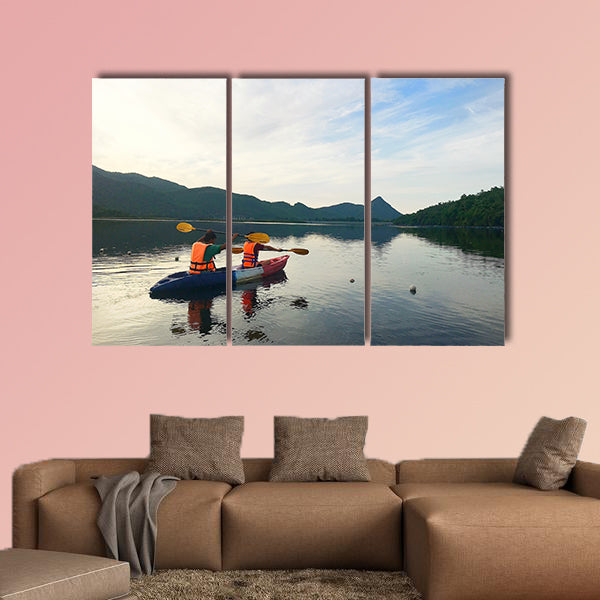 Man and woman are kayaking Multi panel canvas wall art