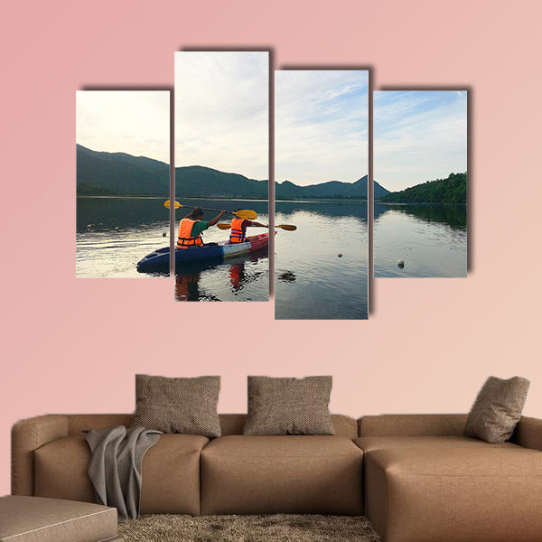 Man and woman are kayaking Multi panel canvas wall art