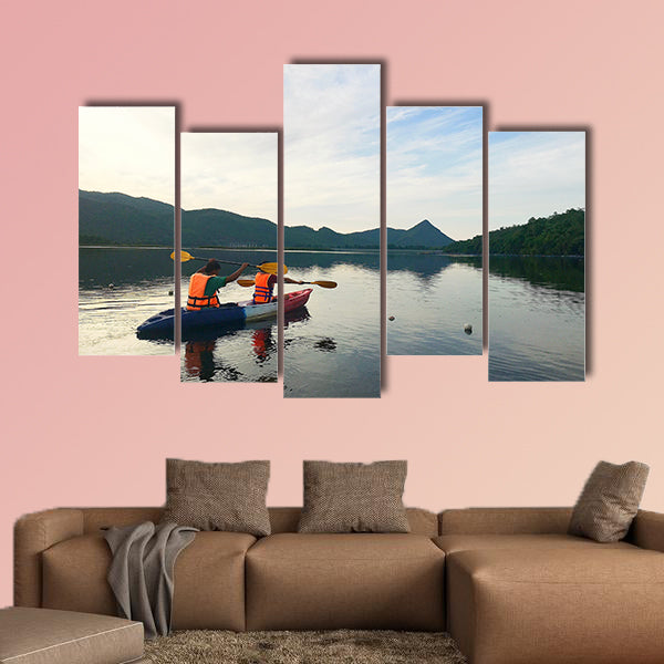 Man and woman are kayaking Multi panel canvas wall art