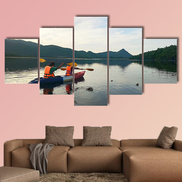 Man and woman are kayaking Multi panel canvas wall art