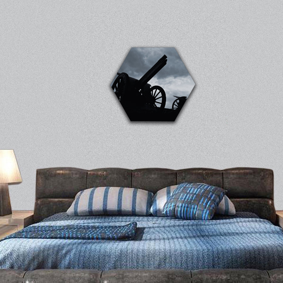 Cannon silhouettes in the late evening hexagonal canvas wall art