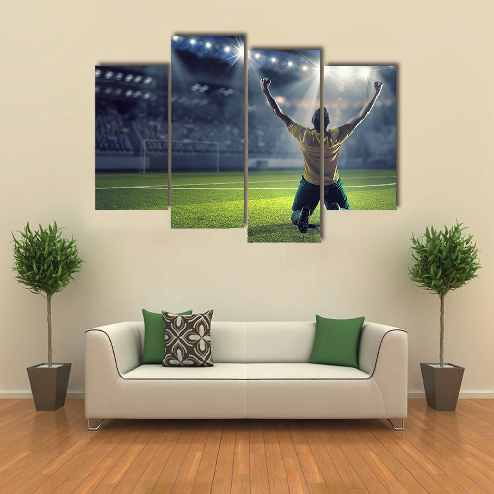 Soccer player celebrating victory while holding win cup Multi panel canvas wall art