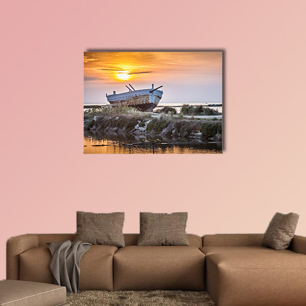An old and weathered boat at the Sicilian sunset multi panel canvas wall art