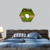 Golf ball on the golf course with sandbanks hexagonal canvas wall art