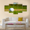 Golf ball on the beautiful golf course with sandbanks Multi Panel Canvas Wall Art