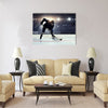 Hockey player in blue uniform Multi panel canvas wall art