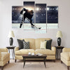 Hockey player in blue uniform Multi panel canvas wall art