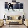 Hockey player in blue uniform Multi panel canvas wall art