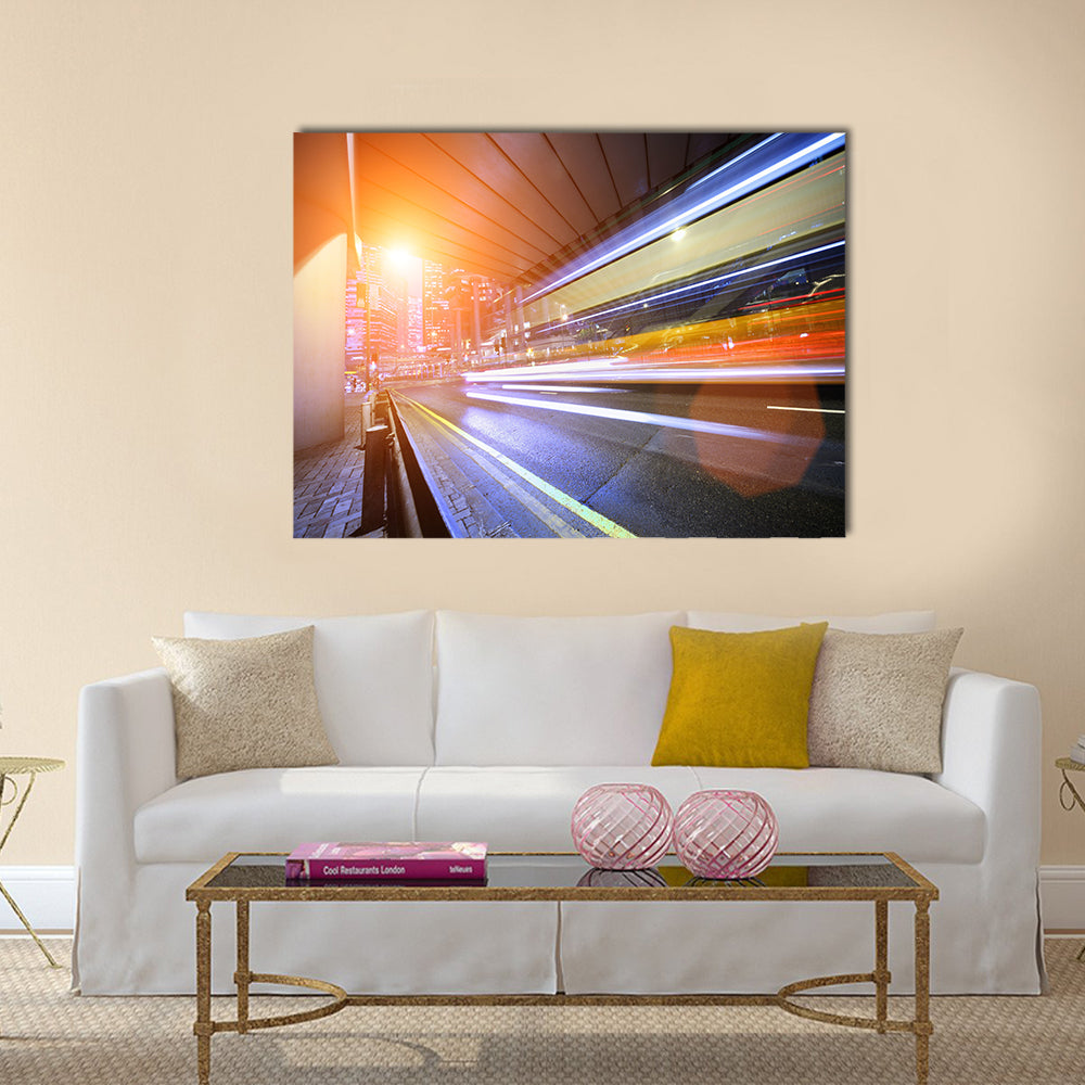 Bus speeding through night street. Hong Kong multi panel canvas wall art