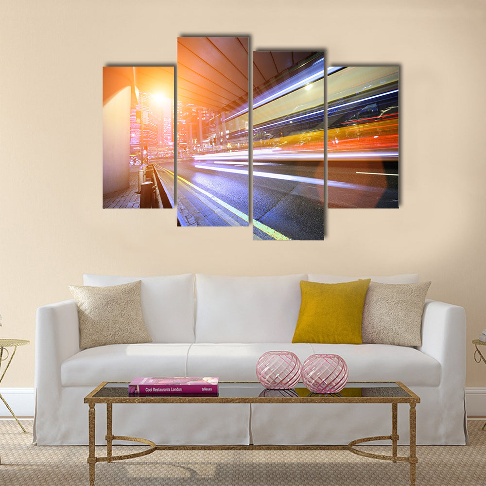 Bus speeding through night street. Hong Kong multi panel canvas wall art