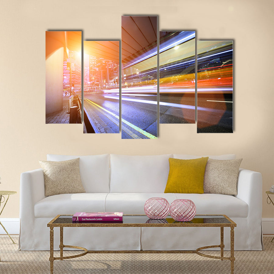 Bus speeding through night street. Hong Kong multi panel canvas wall art