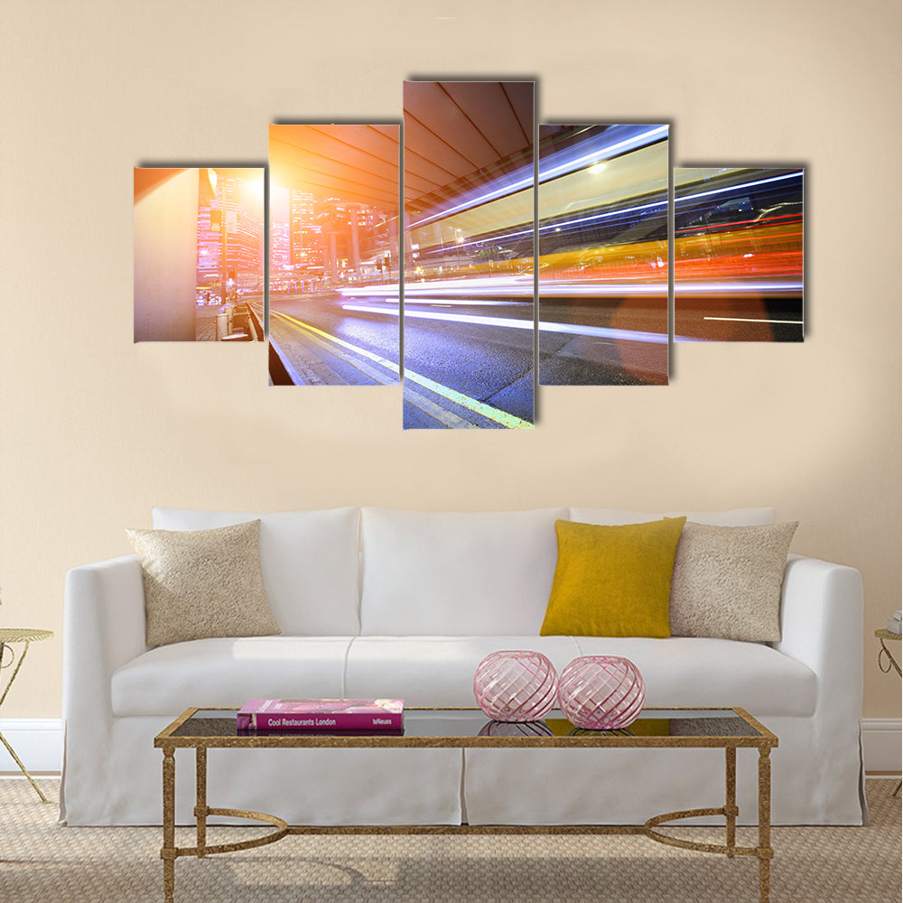 Bus speeding through night street. Hong Kong multi panel canvas wall art