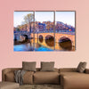 Traditional Dutch houses and old bridges on the canals in Amsterdam wall art