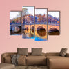 Traditional Dutch houses and old bridges on the canals in Amsterdam wall art