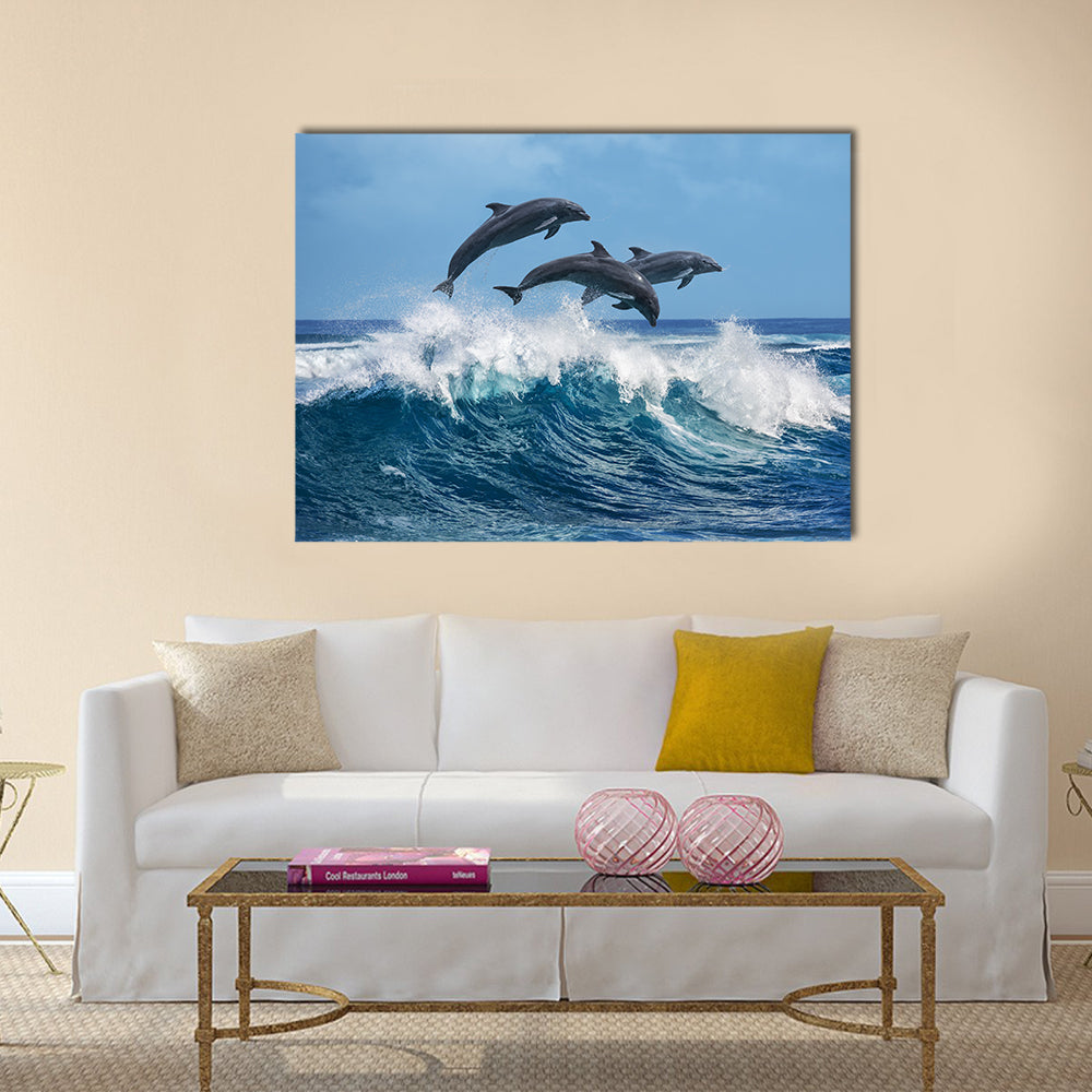 Three Beautiful Dolphins Jumping Over Breaking Waves Multi Panel Canvas Wall Art