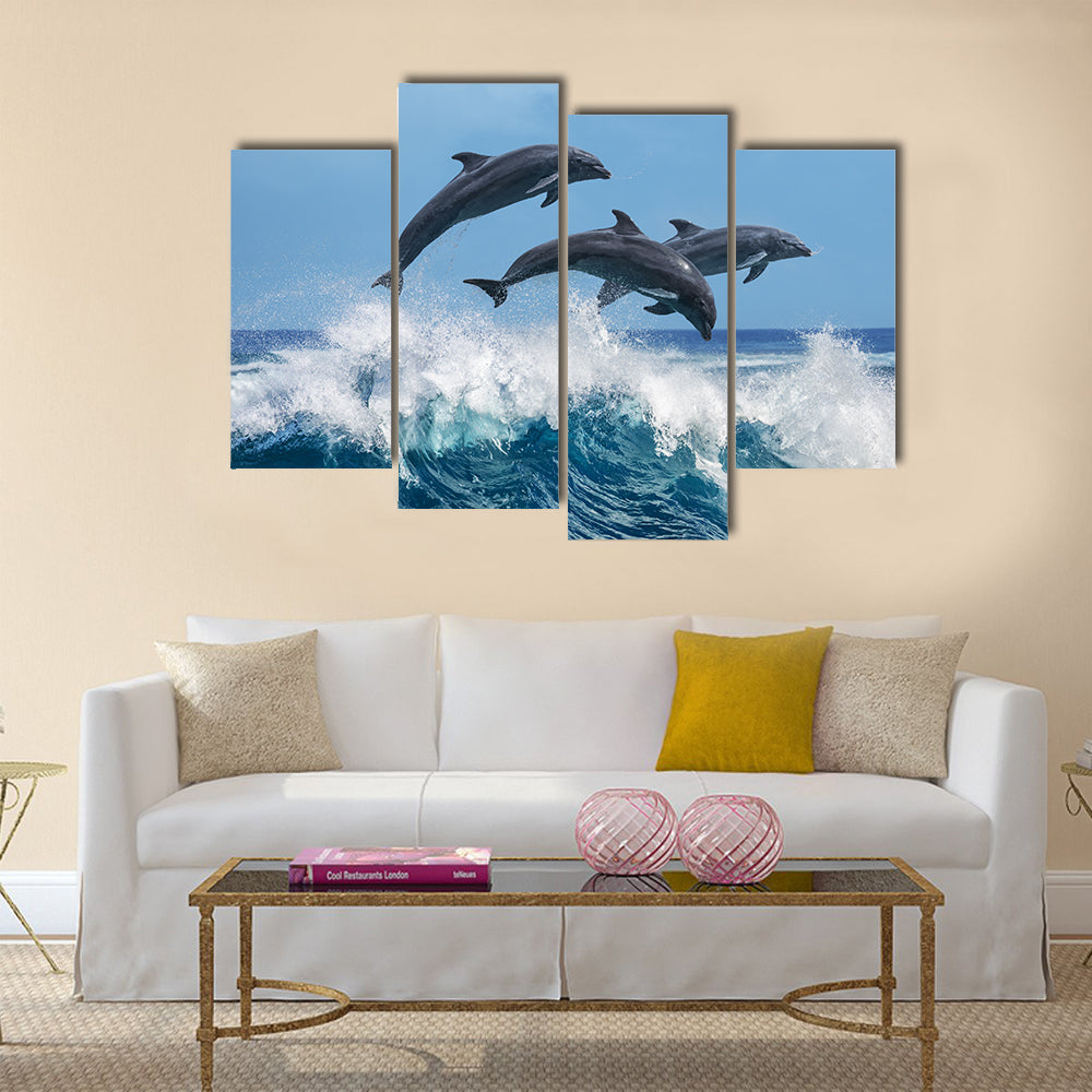 Three Beautiful Dolphins Jumping Over Breaking Waves Multi Panel Canvas Wall Art