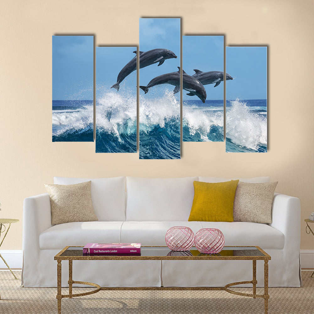 Three Beautiful Dolphins Jumping Over Breaking Waves Multi Panel Canvas Wall Art