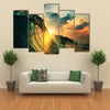 A Rough Colored Ocean Wave Falling Down At Sunset Time, Multi Panel Canvas Wall Art