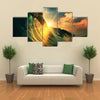 A Rough Colored Ocean Wave Falling Down At Sunset Time, Multi Panel Canvas Wall Art