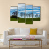 Large trees silhouetted against a blue sky Multi Panel Canvas Wall Art