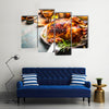 Roasted whole turkey or chicken on festive rustic table with festive Multi panel canvas wall art