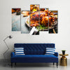 Roasted whole turkey or chicken on festive rustic table with festive Multi panel canvas wall art