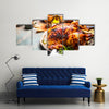 Roasted whole turkey or chicken on festive rustic table with festive Multi panel canvas wall art