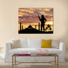 Armed terrorists near the mosque at sunset Multi Panel Canvas Wall Art