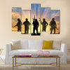 Armed terrorists near the city at sunset Multi Panel Canvas Wall Art