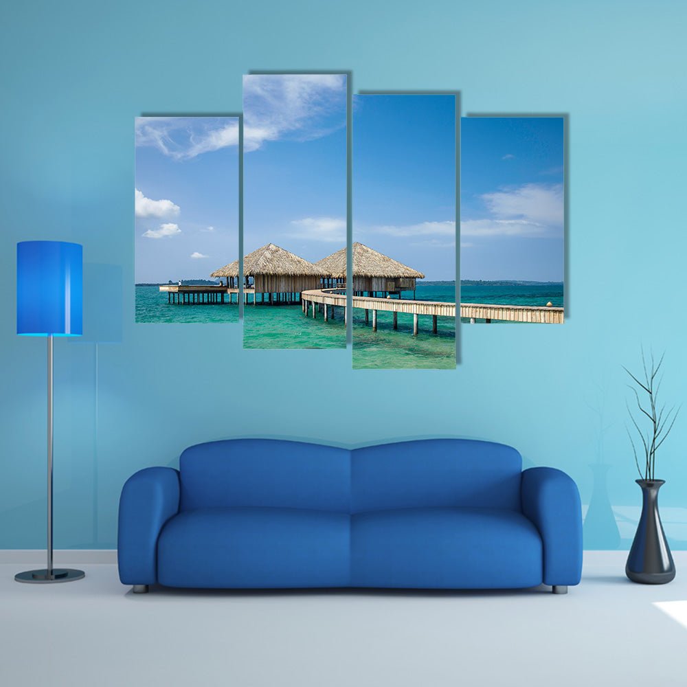 The Water Bungalows on the tropical lagoon in Maldives Multi Panel Canvas Wall Art