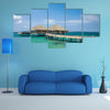 The Water Bungalows on the tropical lagoon in Maldives Multi Panel Canvas Wall Art