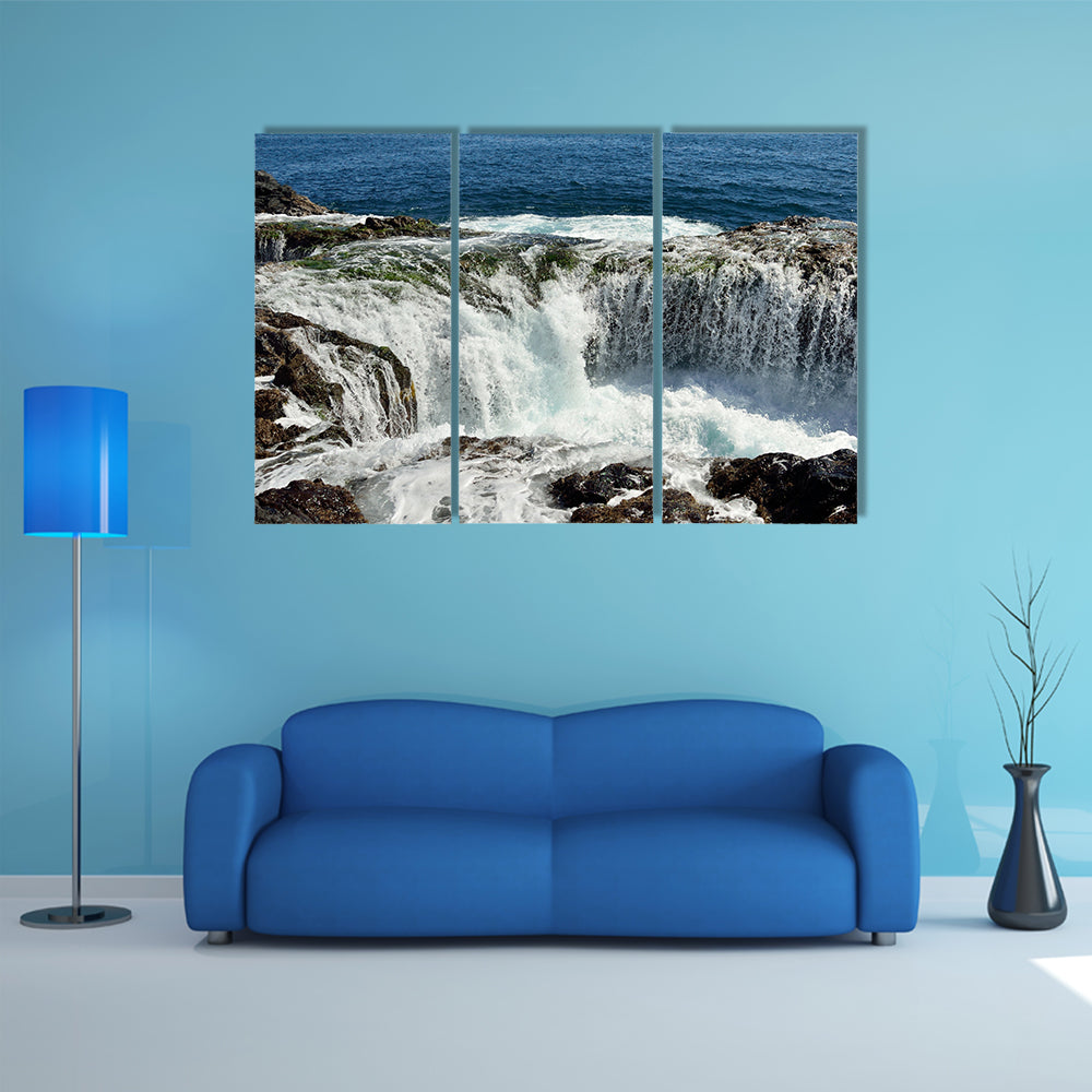 Spontaneous waterfall in natural pool at high tide, coast of Telde multi panel canvas wall art