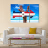 Dominican Republic flag sign with arrow on beach Multi Panel Canvas Wall Art