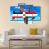 Dominican Republic flag sign with arrow on beach Multi Panel Canvas Wall Art