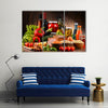 Composition with variety of organic food products on kitchen table Multi panel canvas wall art