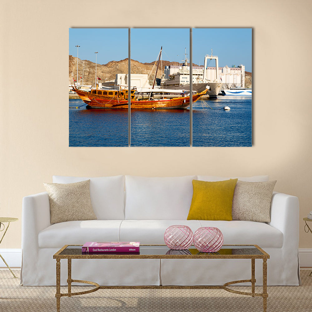 Old boat in the sidewalk near the sea in Oman multi panel canvas wall art