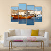 Old boat in the sidewalk near the sea in Oman multi panel canvas wall art