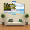 Beachfront bungalow on a tropical island Multi panel canvas wall art