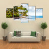 Beachfront bungalow on a tropical island Multi panel canvas wall art