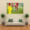 Soccer football players during the team training with ball and marker cones Multi panel canvas wall art