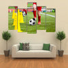 Soccer football players during the team training with ball and marker cones Multi panel canvas wall art