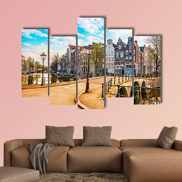 Traditional Dutch old houses and bridges on canals in Amsterdam, canvas wall art
