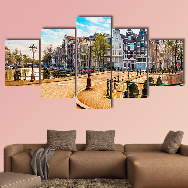 Traditional Dutch old houses and bridges on canals in Amsterdam, canvas wall art