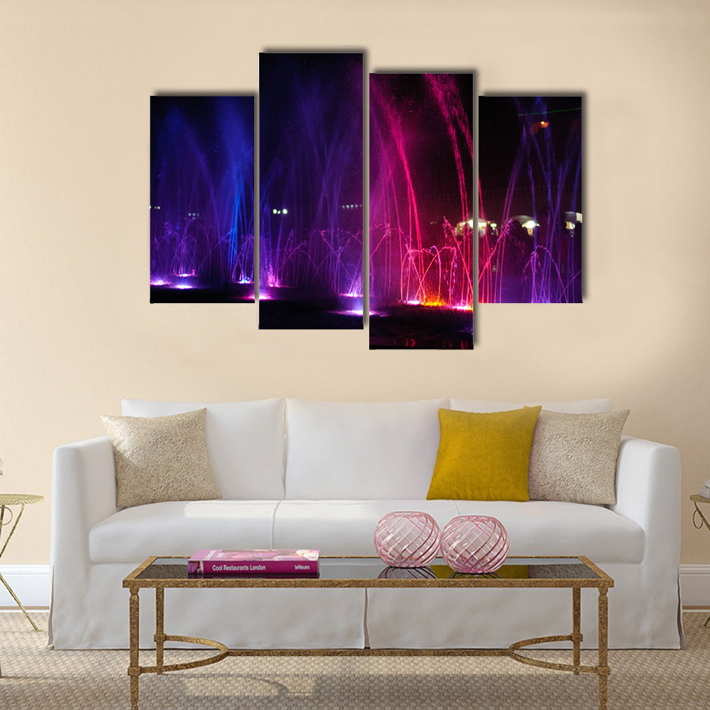 fountain in night illuminated red and blue colors multi panel canvas wall art