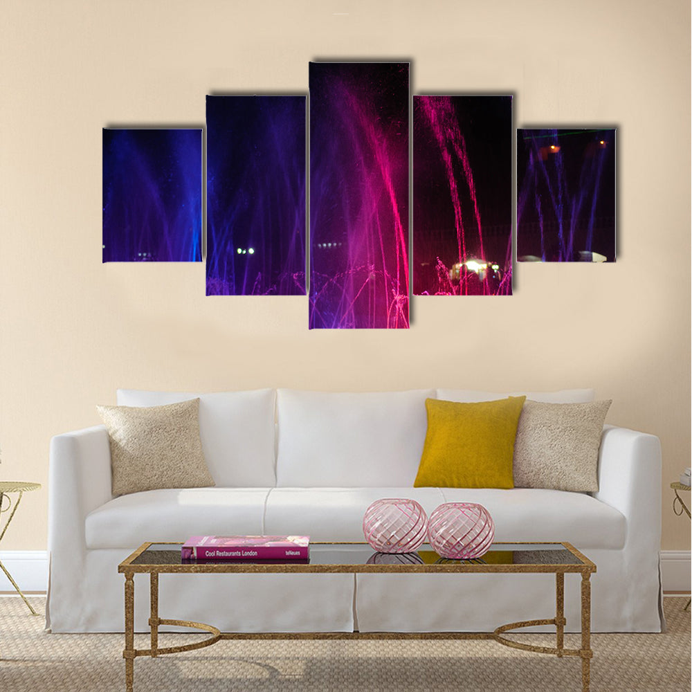 fountain in night illuminated red and blue colors multi panel canvas wall art