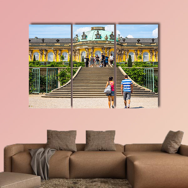 Tourists visiting the Schloss Sanssouci royal summer palace multi panel canvas wall art