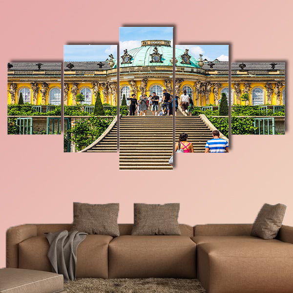 Tourists visiting the Schloss Sanssouci royal summer palace multi panel canvas wall art